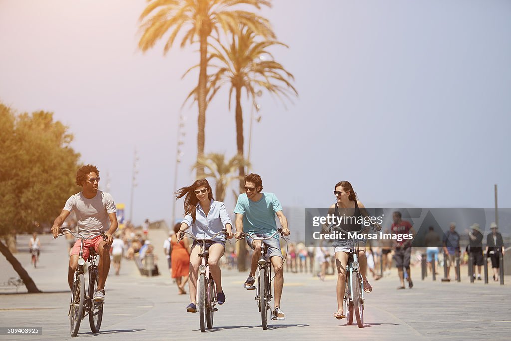 Friends riding bicycles during summer vacations