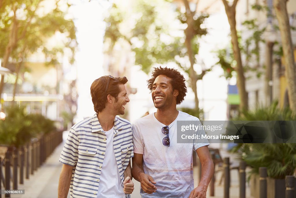 Male friends walking outdoors