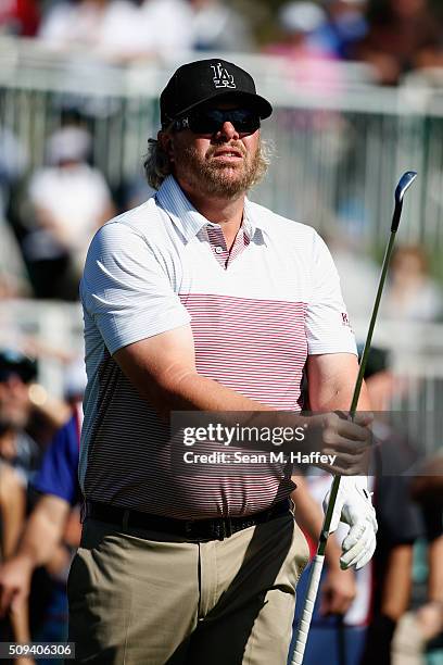 Musician Toby Keith reacts to his drive off the 17th hole during the 3M Celebrity Challenge prior to the AT&T Pebble Beach National Pro-Am at Pebble...