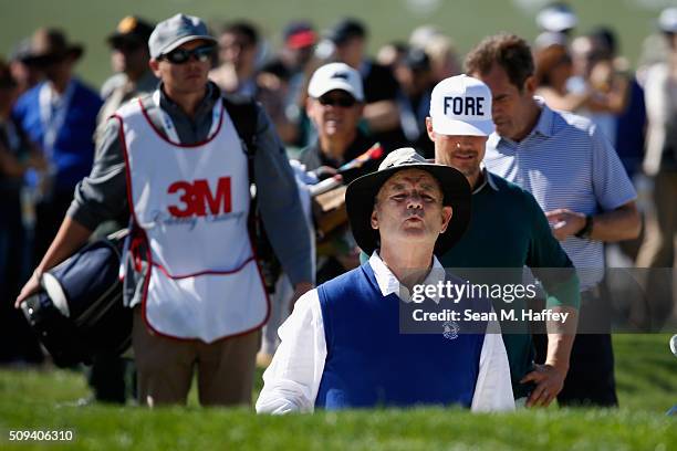 Comedian Bill Murray reacts to a shot out of a bunker on the second hole during the 3M Celebrity Challenge prior to the AT&T Pebble Beach National...