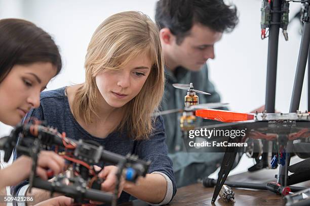 working on a robotic drone - engeneer student electronics stock pictures, royalty-free photos & images