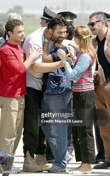 Italian hostage Maurizio Agliana is greeted by his sister Antonella as he arrives at Ciampino Military airbase on June 9, 2004 in Rome, Italy. The...
