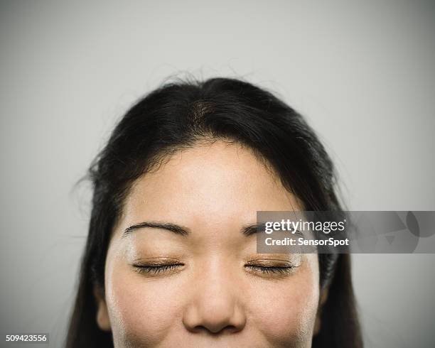 portrait of a young japanese woman looking at camera - teen meditating stock pictures, royalty-free photos & images