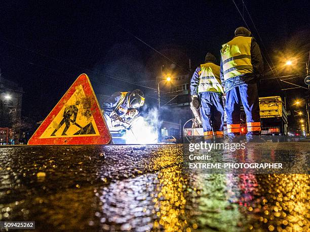 street welder - road night stock pictures, royalty-free photos & images