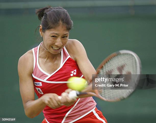Shinobu Asagoe of Japan plays a backhand during her second round match against Nadia Petrova of Russia at the DFS Classic at Edgbaston on June 9,...