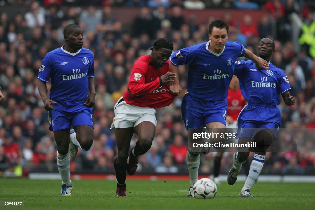 John Terry, Geremi and Claude Makelele of Chelsea take on Louis Saha of Manchester United