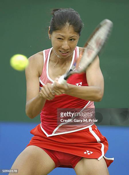 Shinobu Asagoe of Japan plays a backhand during her second round match against Nadia Petrova of Russia at the DFS Classic at Edgbaston on June 9,...