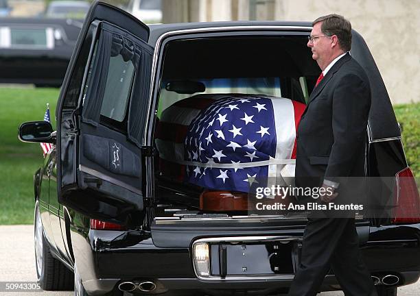 The flag draped casket of former President Ronald Reagan is placed into the hearse for transport to the Pt. Mugu Naval Air Station at the Ronald...