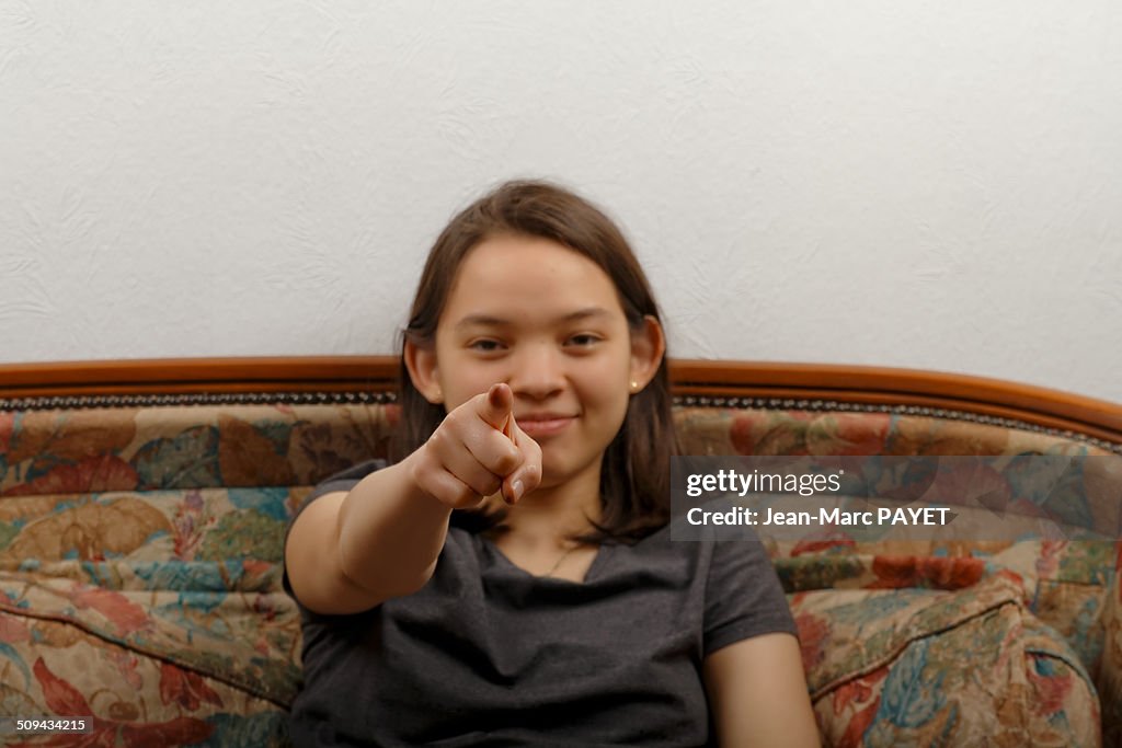 Teenager's portrait showing something of finger