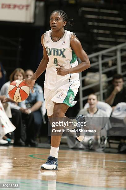 Teresa Edwards of the Minnesota Lynx advances the ball upcourt during the game against the New York Liberty on May 30, 2004 at the Target Center in...