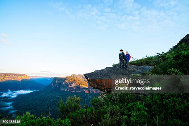 senior couple hiking in the australia outback. - blue mountains stock pictures, royalty-free photos & images