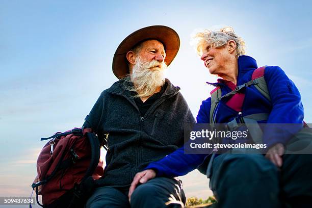 senior couple hiking in the australia outback. - bush live stockfoto's en -beelden