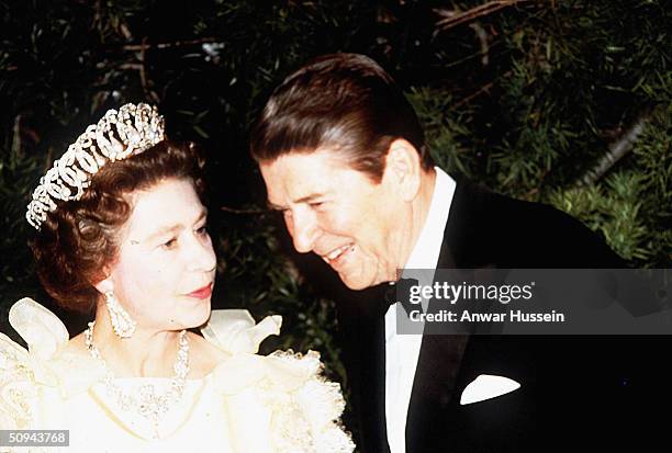 Her Majesty Queen Elizabeth II and President Ronald Reagan share a joke during a banquet in March 1983 in San Francisco, California.