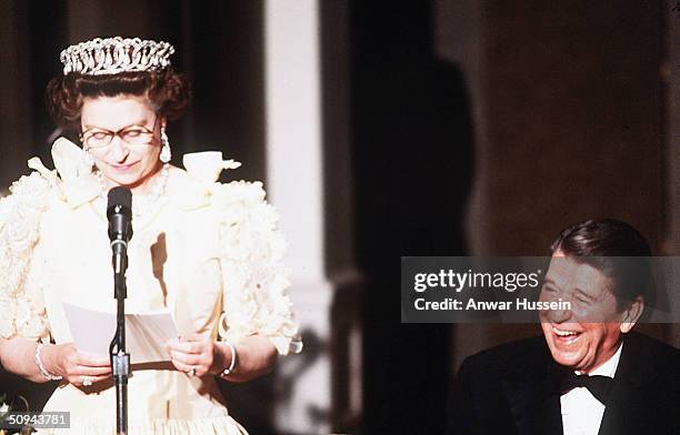 President Ronald Reagan laughs as Her Majesty Queen Elizabeth II delivers a speech during a banquet in March 1983 in San Francisco, California.