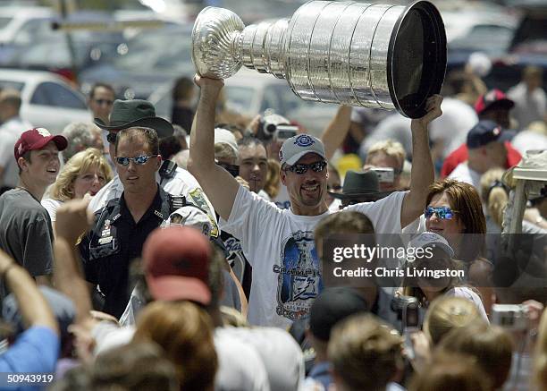 Tampa Bay Lightning Captain Dave Andreychuk holds up the NHL Stanley Cup trophy during a victory parade June 9, 2004 in Tampa, Florida. The Lightning...