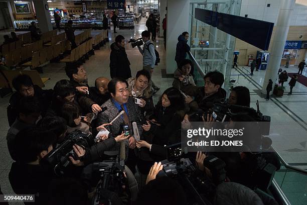 Businessman on his way to retrieve his belongings talks to reporters at the CIQ immigration office, a checkpoint leading to the Kaesong joint...