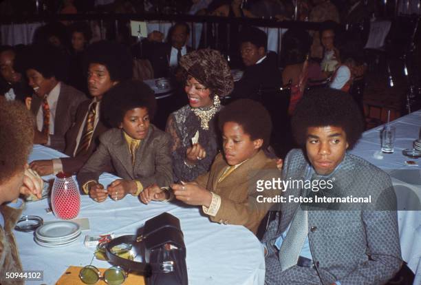 The Jacksons attend the NAACP Image Awards, Los Angeles, California, November 19, 1970. From right, Tito Jackson, Marlon Jackson, unidentified woman,...