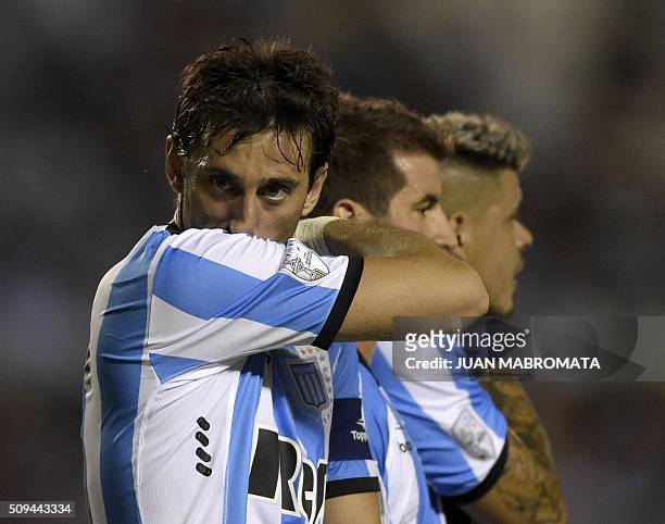 Argentina's Racing Club forward Diego Milito gestures next to teammates during the Copa Libertadores 2016 football match against Mexico's Puebla at...