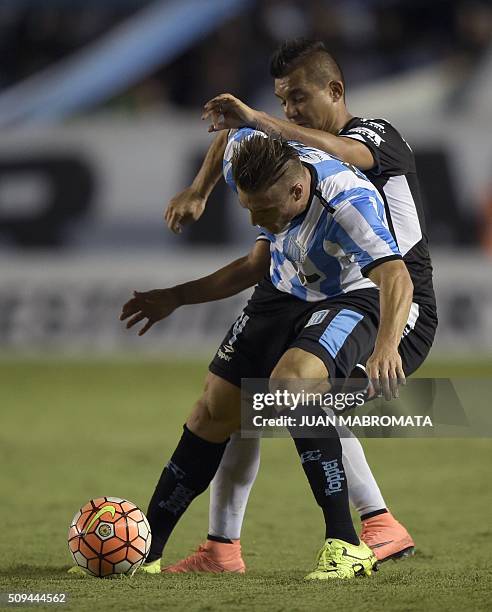 Argentina's Racing Club defender Ivan Pillud vies for the ball with Mexico's Puebla defender Carlos Gutierrez during their Copa Libertadores 2016...