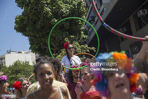 Revelers dance with hula hoops during the Bloco das Mulheres Rodadas Carnival parade in Rio de Janeiro, Brazil, on Wednesday, Feb. 10, 2016. The...