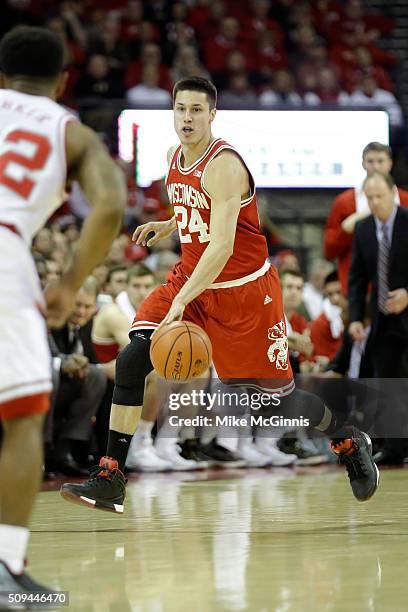 Bronson Koenig of the Wisconsin Badgers dribbles the basketball up the court during the first half against the Purdue Boilermakers at Kohl Center on...