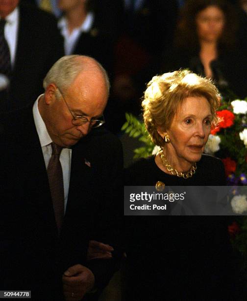 Vice President Dick Cheney escorts former first lady Nancy Reagan to the casket of her husband, former U.S. President Ronald Reagan, during his state...