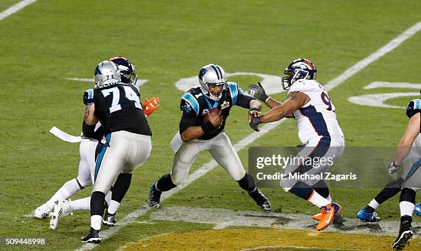 Sylvester Williams of the Denver Broncos pressures Cam Newton of the Carolina Panthers during Super Bowl 50 at Levi Stadium on February 7, 2016 in...