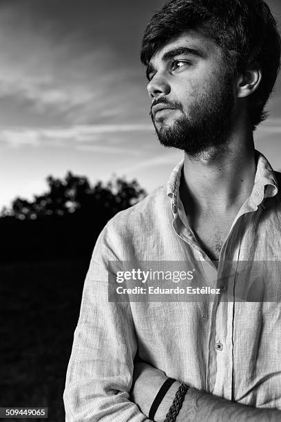 young man photographed at sunset - aceituna ストックフォトと画像