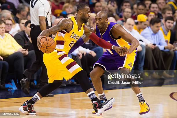 Kobe Bryant of the Los Angeles Lakers guards LeBron James of the Cleveland Cavaliers during the first half at Quicken Loans Arena on February 10,...