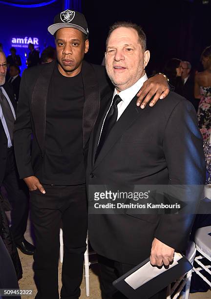Jay Z and Harvey Weinstein attend the 2016 amfAR New York Gala at Cipriani Wall Street on February 10, 2016 in New York City.