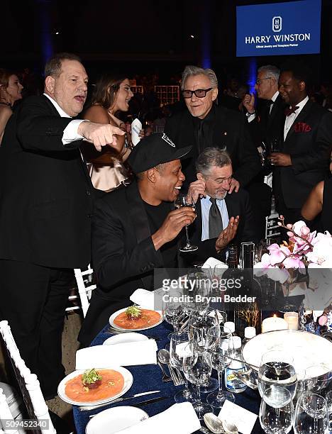 Producer Harvey Weinstein, recording artist Jay Z, actor Harvey Keitel and actor Robert De Niro are seen during Moet & Chandon Toasts to the amfAR...