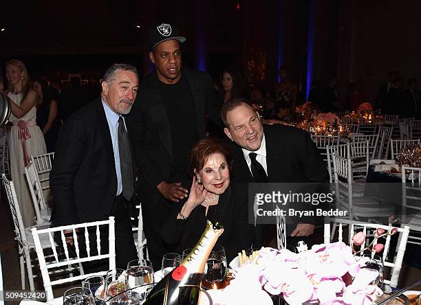 Actor Robert De Niro, recording artist Jay Z, Miriam Weinstein and producer Harvey Weinstein are seen during Moet & Chandon Toasts to the amfAR Gala...