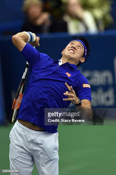 Kei Nishikori of Japan serves to Ryan Harrison of the United States during their singles match on Day 3 of the Memphis Open at the Racquet Club of...