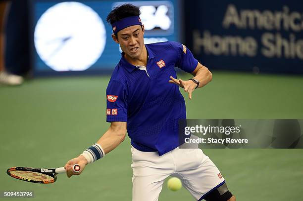 Kei Nishikori of Japan returns a shot from Ryan Harrison of the United States during their singles match on Day 3 of the Memphis Openat the Racquet...