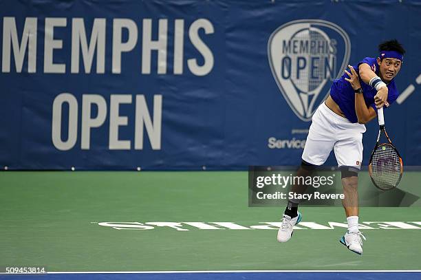 Kei Nishikori of Japan serves to Ryan Harrison of the United States during their singles match on Day 3 of the Memphis Open at the Racquet Club of...