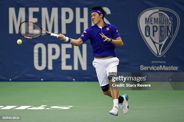 Kei Nishikori of Japan returns a shot from Ryan Harrison of the United States during their singles match on Day 3 of the Memphis Openat the Racquet...
