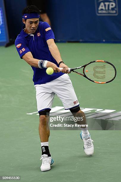 Kei Nishikori of Japan returns a shot to Ryan Harrison of the United States during their singles match on Day 3 of the Memphis Openat the Racquet...
