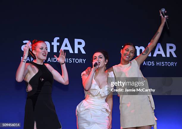 Charli XCX, Caroline Hjelt and Aino Jawo perform onstage during the 2016 amfAR New York Gala at Cipriani Wall Street on February 10, 2016 in New York...