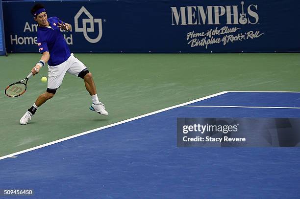 Kei Nishikori of Japan returns a shot to Ryan Harrison of the United States during their singles match on Day 3 of the Memphis Openat the Racquet...