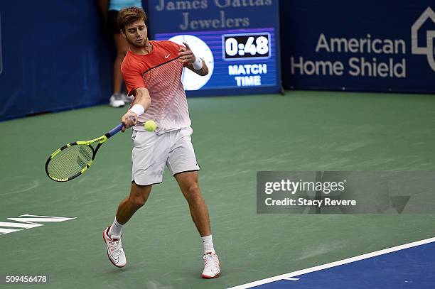 Ryan Harrison of the United States returns a shot by Kei Nishikori of Japan during their singles match on Day 3 of the Memphis Open at the Racquet...