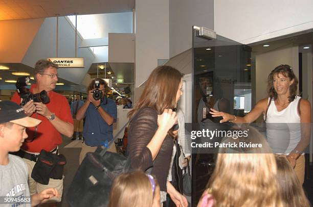 Mary Donaldson, the girlfriend of the Danish Crown Prince Frederick, arriving at the Hobart airport in Tasmania is greeted by a sniffer dog -...