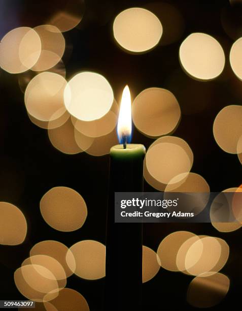 a candle with out of focus lights in background - hatboro fotografías e imágenes de stock