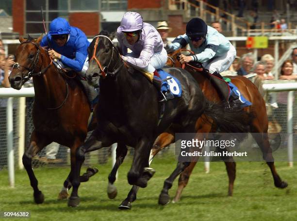 Darryll Holland and Perfect Choice lead the Godolphin trained Financial Times ridden by Frankie Dettori and the Richard Hughes ridden Councellor home...