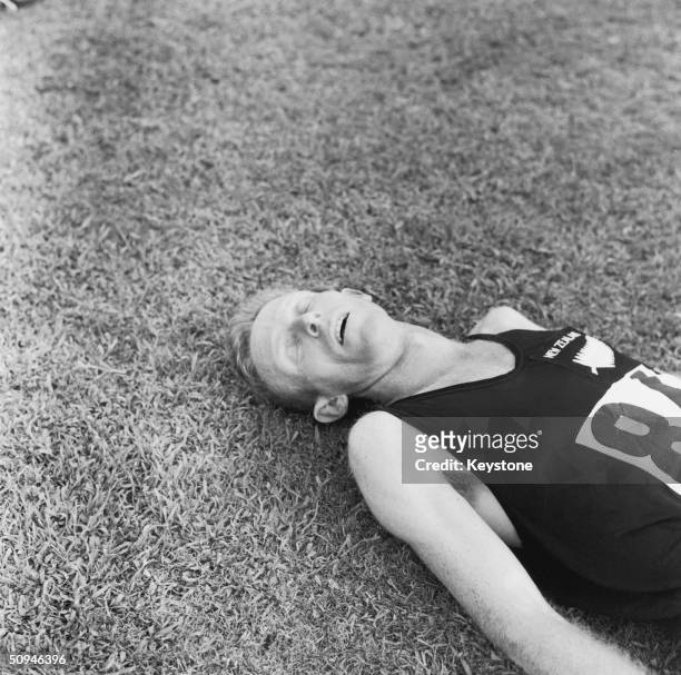 New Zealand runner Murray Halberg lays exhausted after winning the 5,000 metres gold medal in the Rome Olympics, September 1960.
