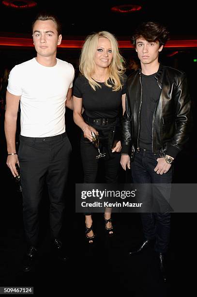 Brandon Lee, actress Pamela Anderson and model Dylan Lee, in Saint Laurent by Hedi Slimane, attend Saint Laurent at the Palladium on February 10,...