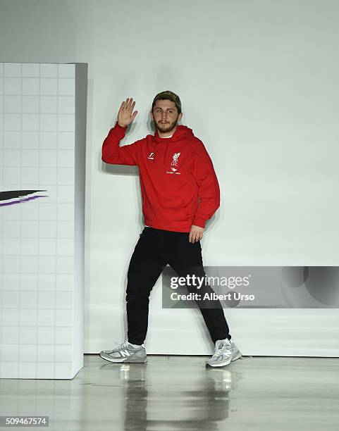 Designer Anton Belinskiy waves to the audience at the VFILES show during Fall 2016 New York Fashion Week at Spring Studios on February 10, 2016 in...