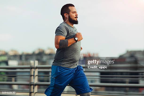 get fit in the city - large man stock pictures, royalty-free photos & images