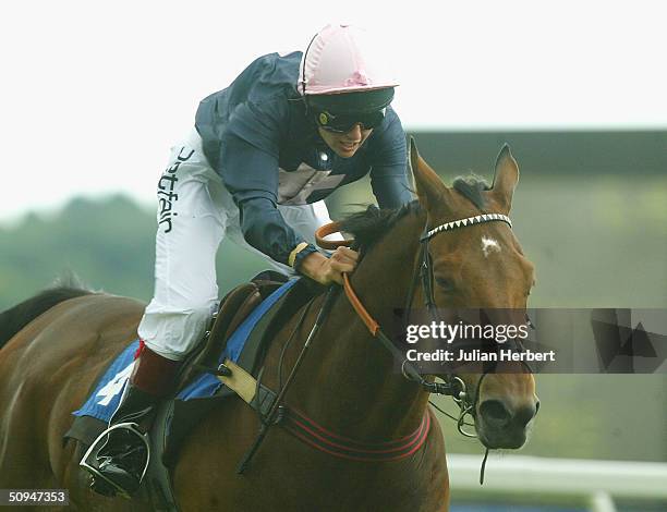 Catherine Dettori, the wife jockey Frankie, brings Cristoford home to land The Cantor Odds Charity Sweepstake Flat Race run at Newbury Racecourse on...