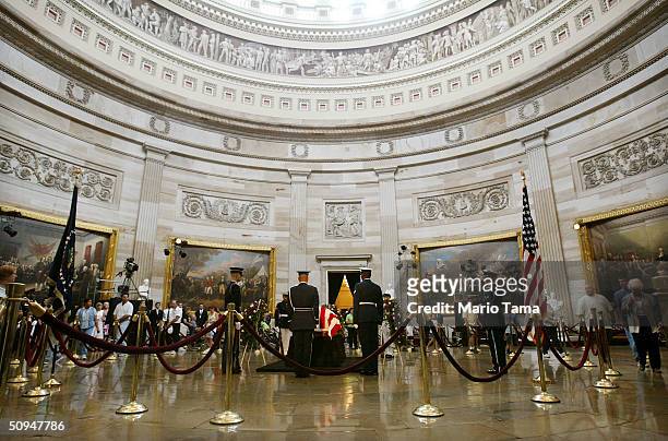 Visitor pays his respects at former President Ronald Reagan's casket inside the U.S. Capitol June 10, 2004 in Washington, DC. Reagan's body will lie...