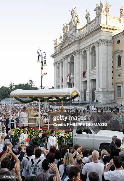 Pope John Paul II passes by pilgrims after an open air mass to celebrate the feast of Corpus Christi, in front of Rome's St John in Lateran basilica,...